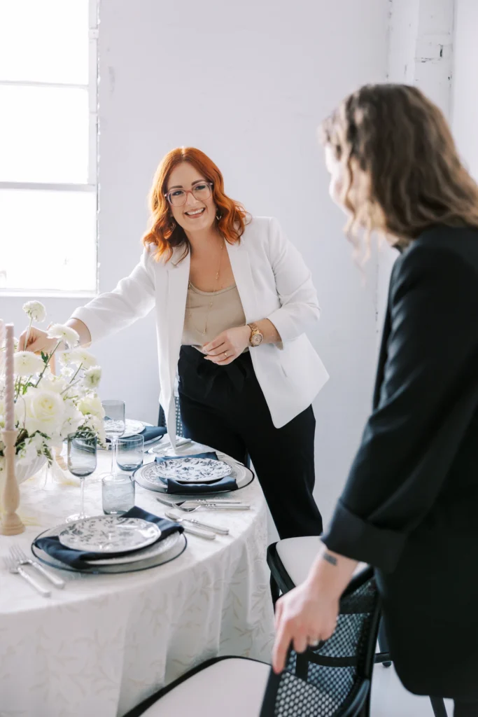 Wedding planners fine tuning the table layout