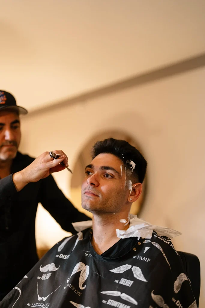 The groom getting his beard done