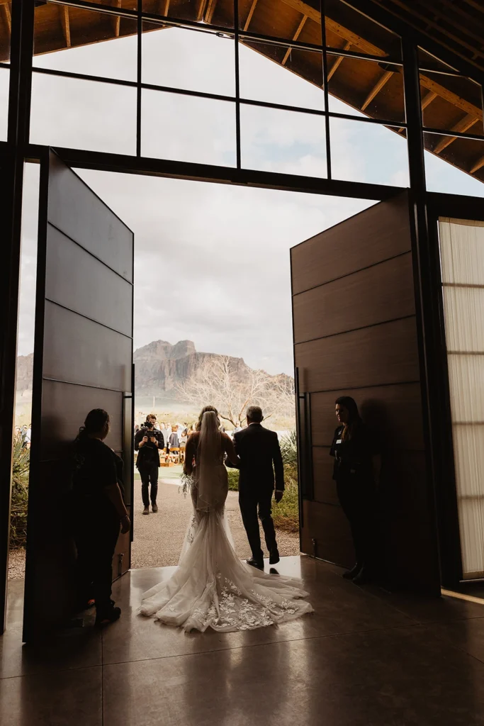 The groom and the bride enter the venue